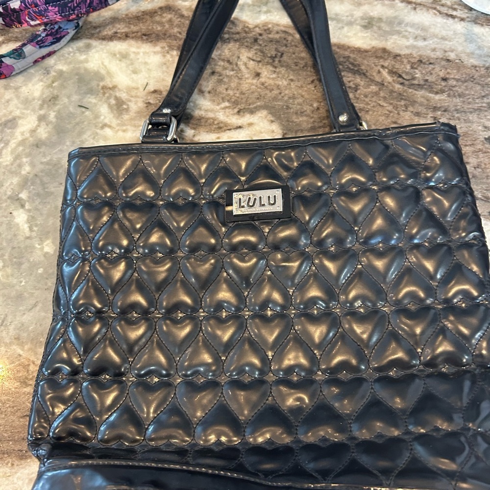 Lulu Guinness patent leather Heart Tote has a bit of wear cracking on straps